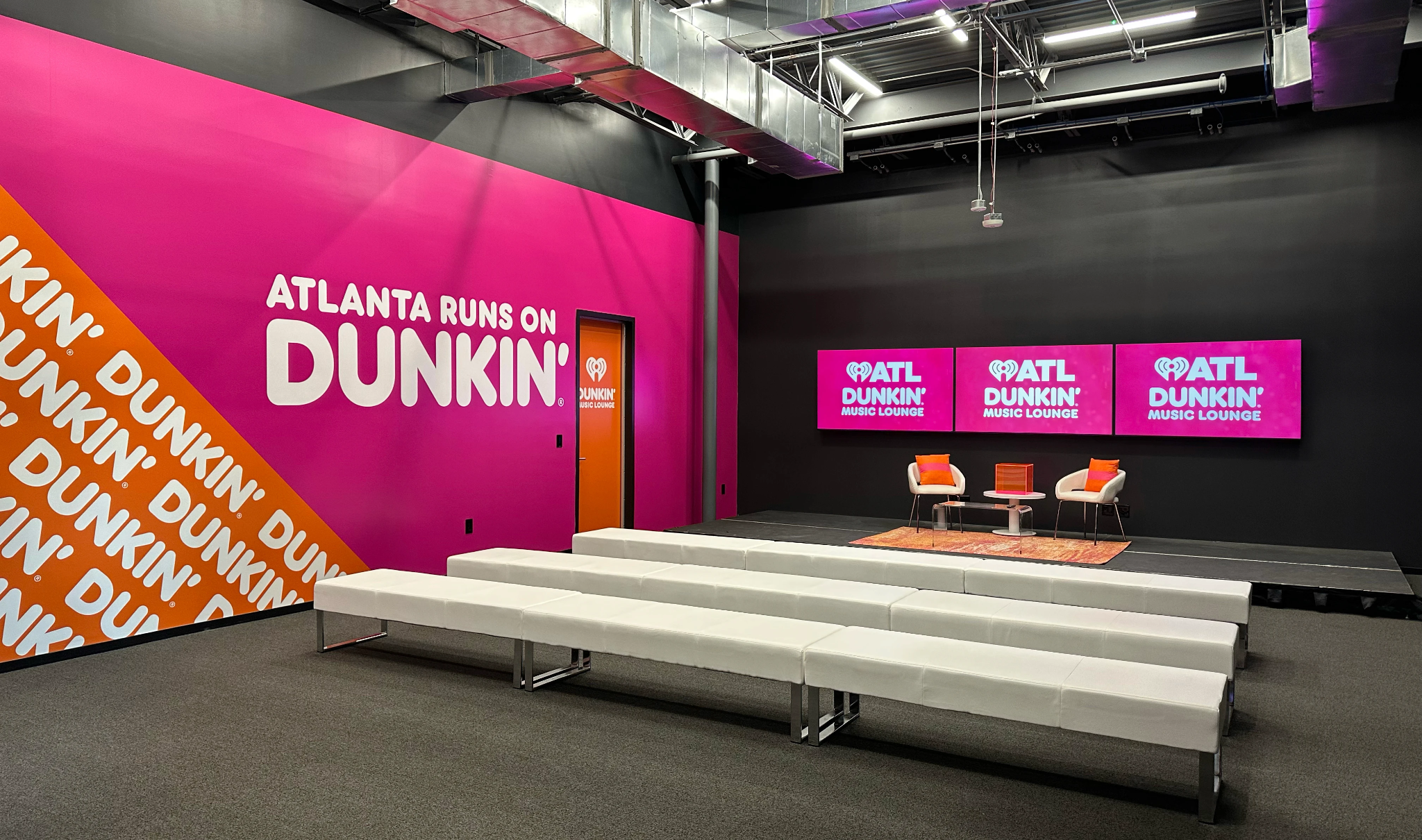 Bright pink Dunkin’ Music Lounge event space